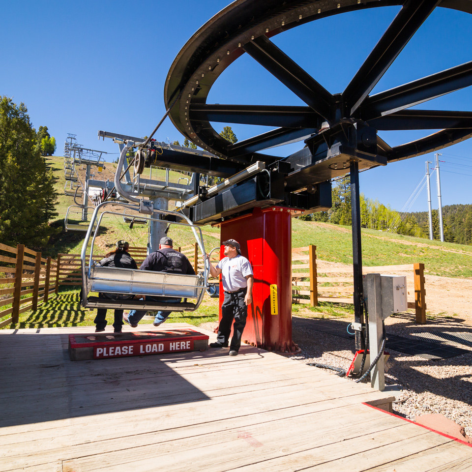 guests loading scenic summer chairlift
