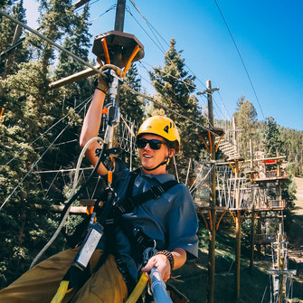 Red River employee on aerial ropes course