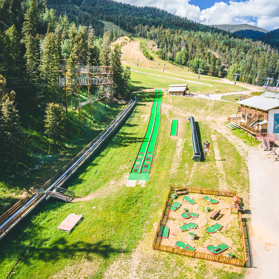 view of mini golf, summer tubing, and ropes course