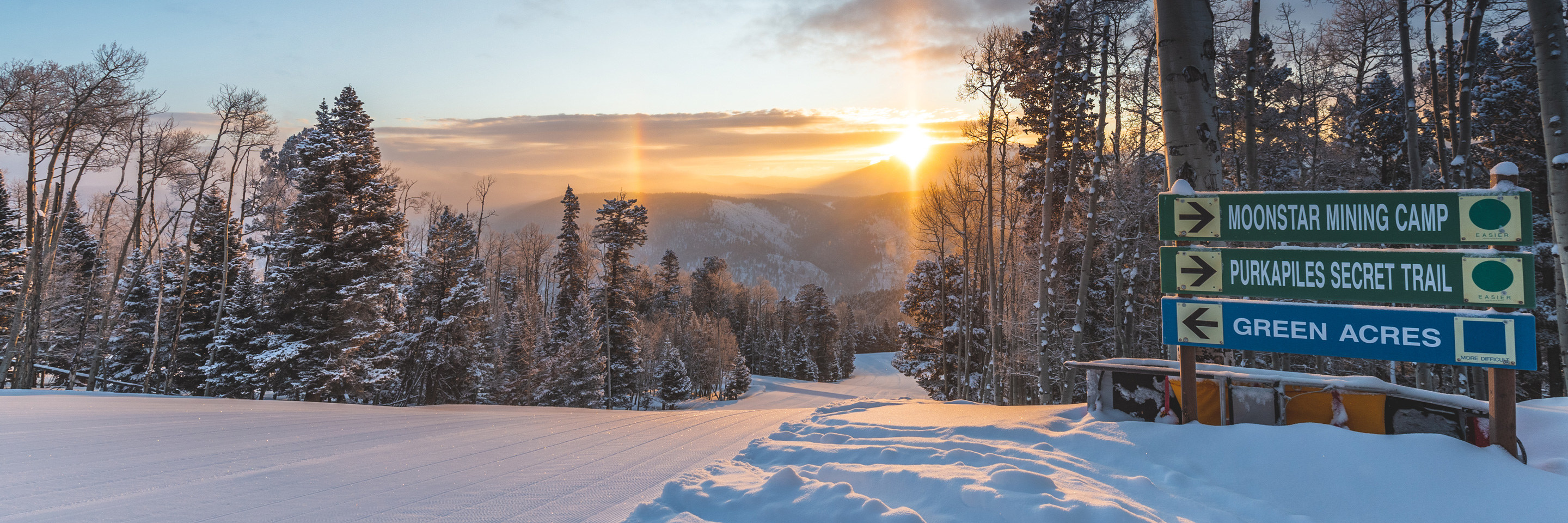 sunrise with fresh snow on ski trail