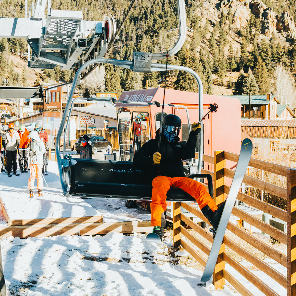 Skier loading chairlift